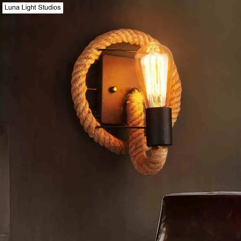 Rustic Indoor Wall Light with Wagon Wheel Design and Rope Shade