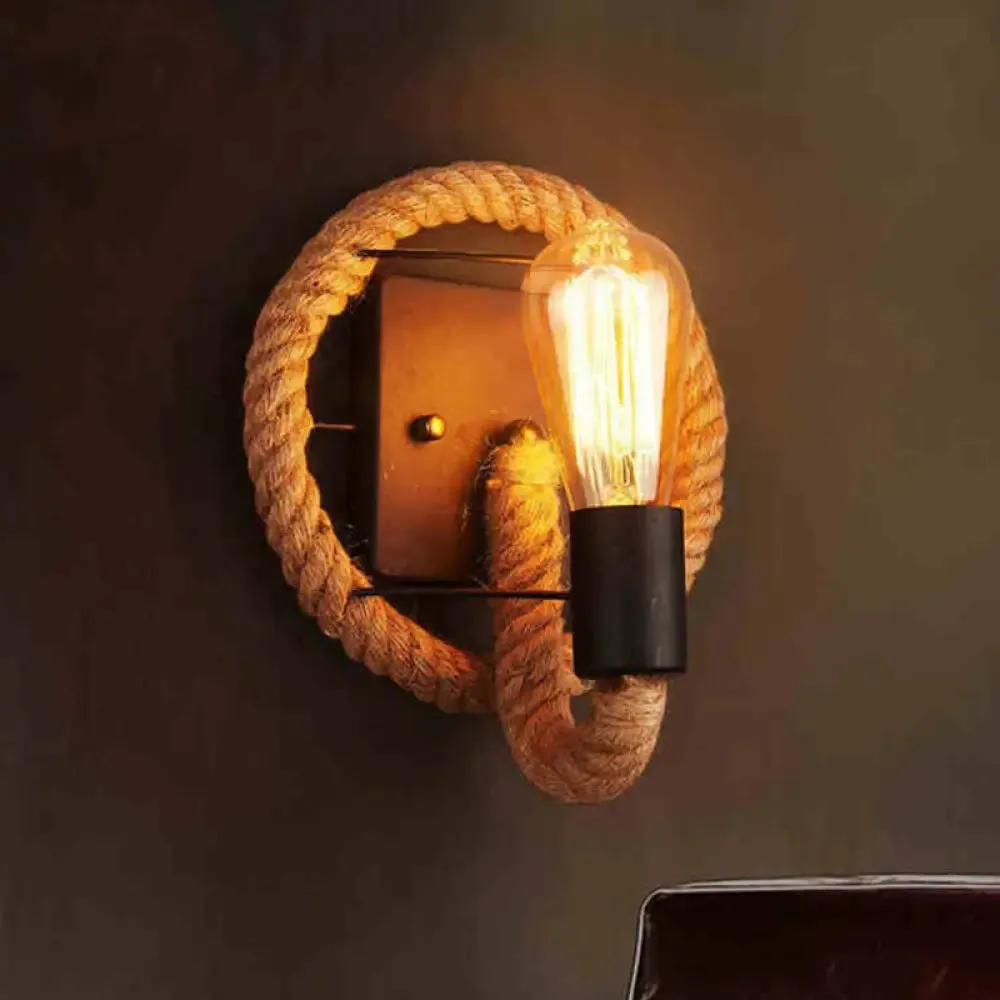 Rustic Indoor Wall Light with Wagon Wheel Design and Rope Shade