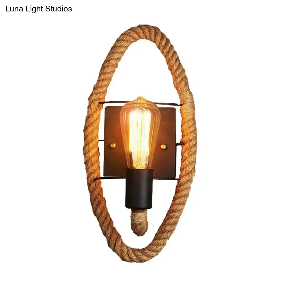 Rustic Indoor Wall Light with Wagon Wheel Design and Rope Shade