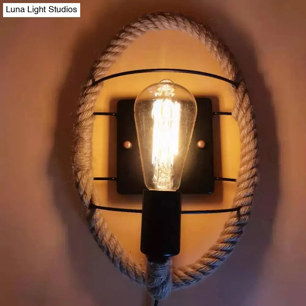 Rustic Indoor Wall Light with Wagon Wheel Design and Rope Shade